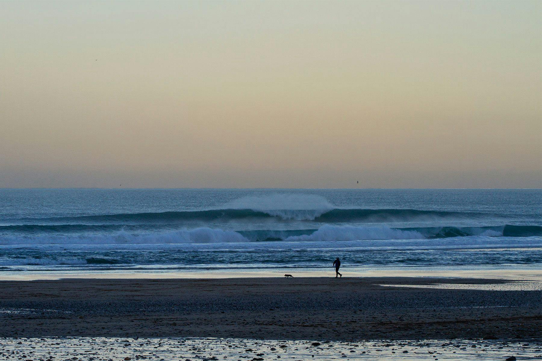 wave breaking at sunrise