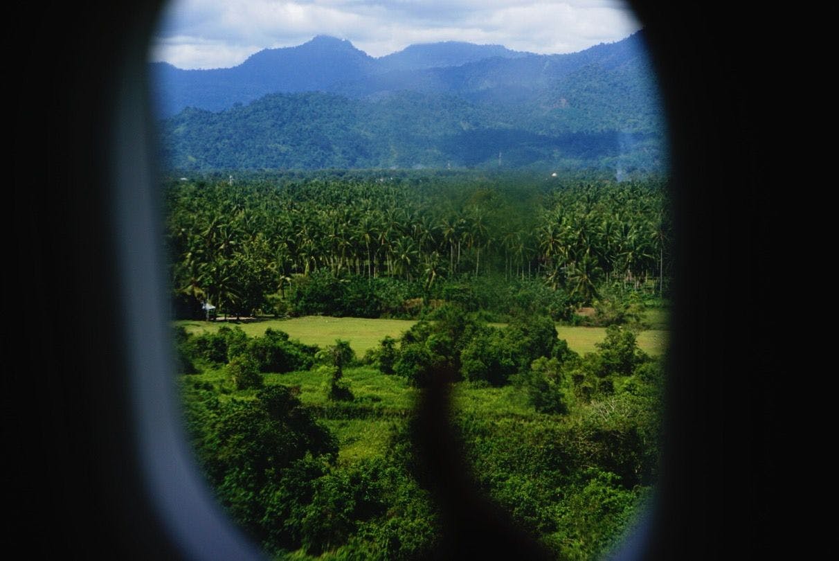 50 feet above the jungle edged runway.