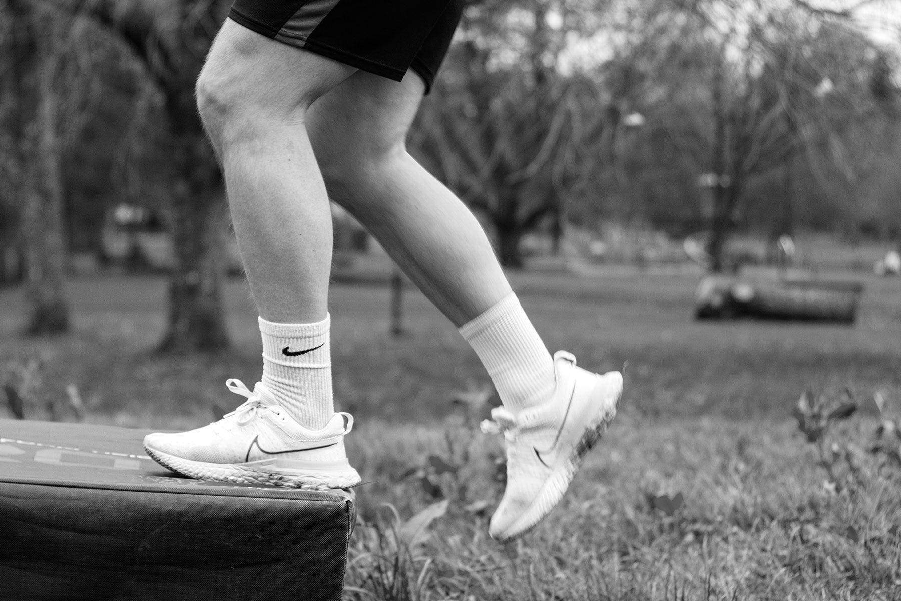 performing step-up exercises onto a box in the winter