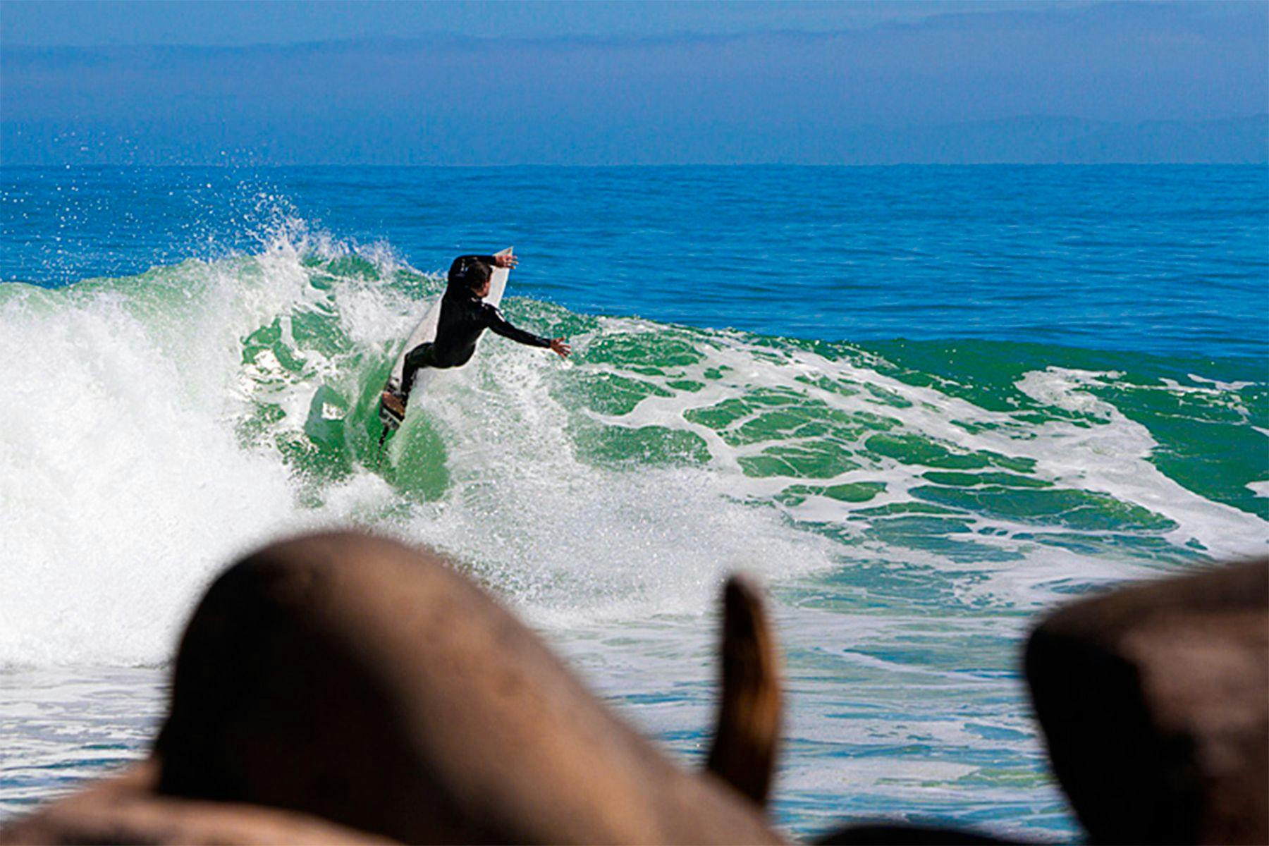 edward atkin, co-director of ecoast, surfing at raglan