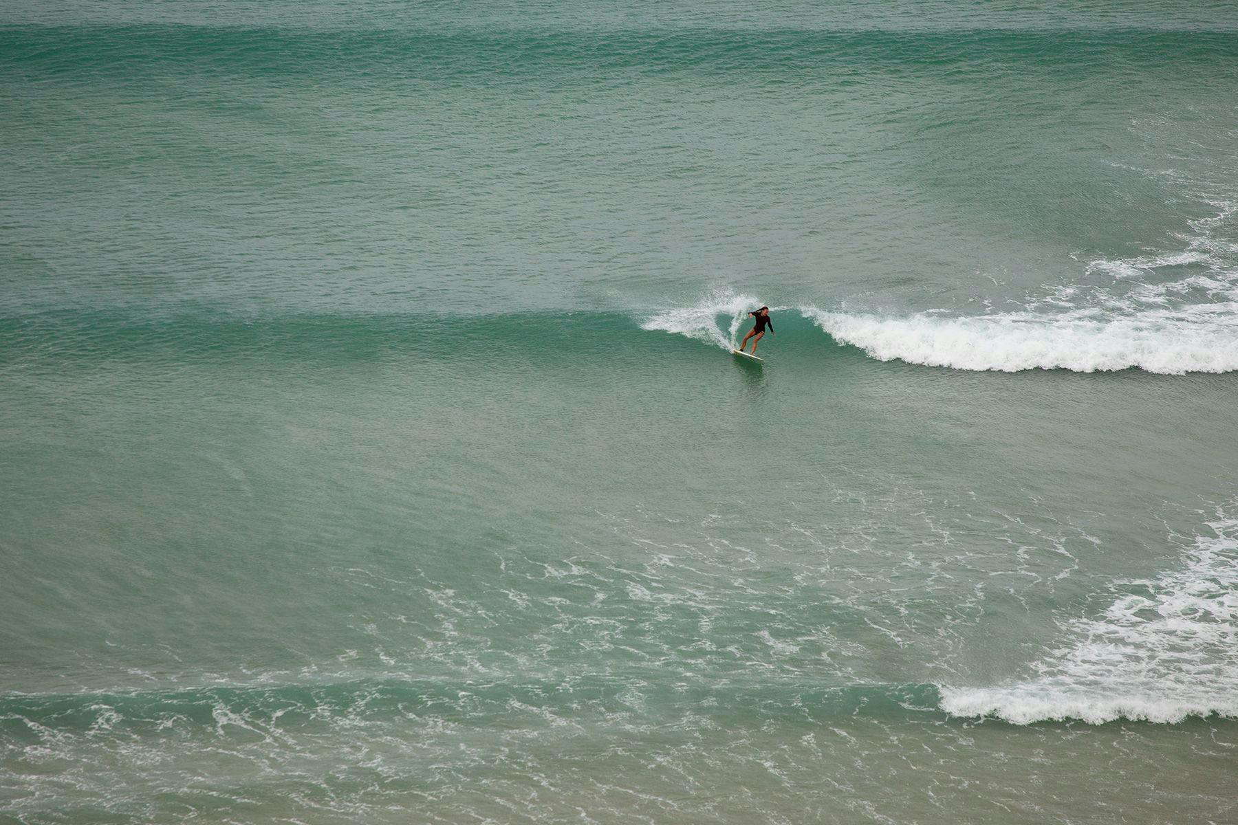 woman surfing in cornwall